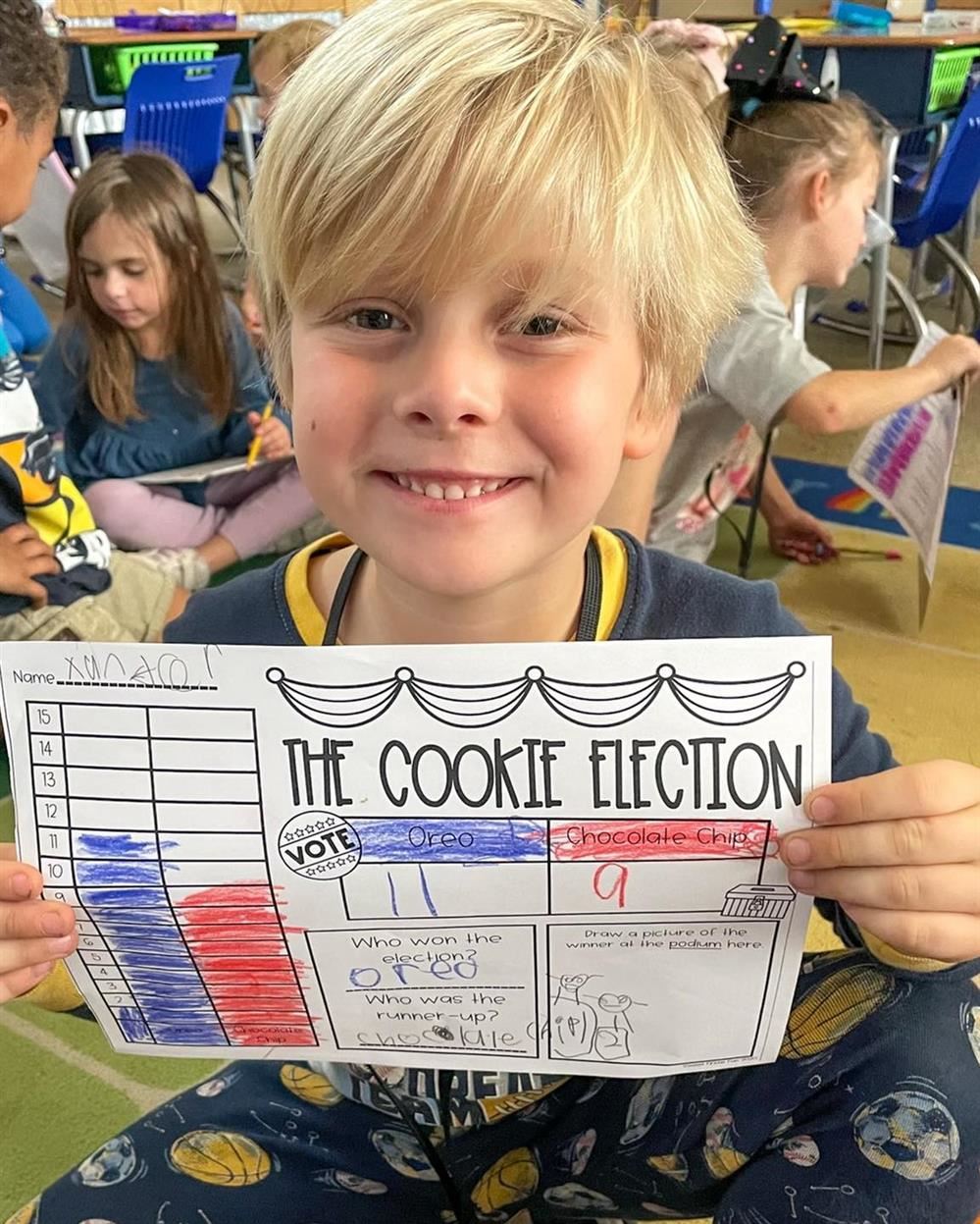  Xander shows the election data he gathered to determine the winner between Chocolate Chip and Oreo.